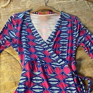 Women’s wrap dress. Pretty wide sleeves. Margaret Joseph’s Macbeth collection